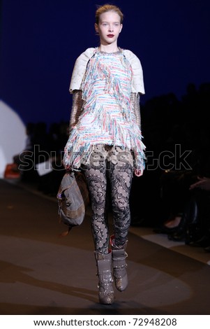 NEW YORK - FEBRUARY 13: Model walks the wooden runway at the Custo Barcelona Fall 2011 Collection presentation during Mercedes-Benz Fashion Week on February 13, 2011 in New York.