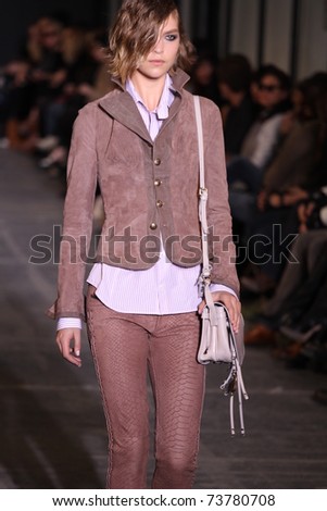 NEW YORK - FEBRUARY 15: Model Arizona Muse walks the wooden runway at the DIESEL BLACK GOLD  Fall 2011 Collection presentation during Mercedes-Benz Fashion Week on February 15, 2011 in New York.