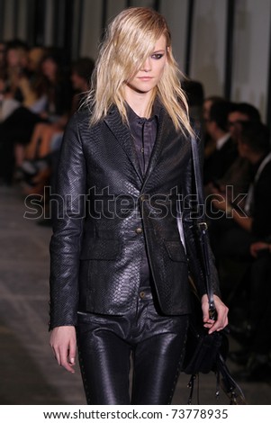 NEW YORK - FEBRUARY 15: Model Kasia Struss walks the wooden runway at the DIESEL BLACK GOLD  Fall 2011 Collection presentation during Mercedes-Benz Fashion Week on February 15, 2011 in New York.