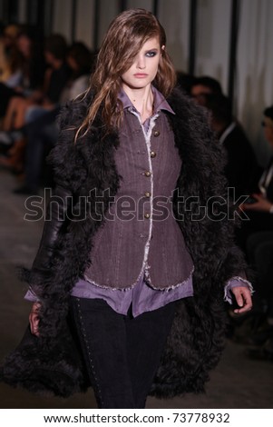 NEW YORK - FEBRUARY 15: Model Katie Fogarty walks the wooden runway at the DIESEL BLACK GOLD  Fall 2011 Collection presentation during Mercedes-Benz Fashion Week on February 15, 2011 in New York.