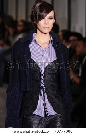 NEW YORK - FEBRUARY 15: Model walks the wooden runway at the DIESEL BLACK GOLD  Fall 2011 Collection presentation during Mercedes-Benz Fashion Week on February 15, 2011 in New York.
