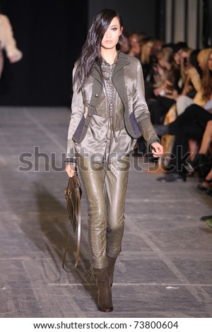 NEW YORK - FEBRUARY 15: Model Shu Pei Qin walks the wooden runway at the DIESEL BLACK GOLD Fall 2011 Collection presentation during Mercedes-Benz Fashion Week on February 15, 2011 in New York