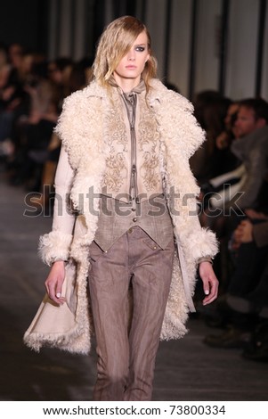 NEW YORK - FEBRUARY 15: Top model Sigrid Agren walks the wooden runway at the DIESEL BLACK GOLD Fall 2011 Collection presentation during Mercedes-Benz Fashion Week on February 15, 2011 in New York.