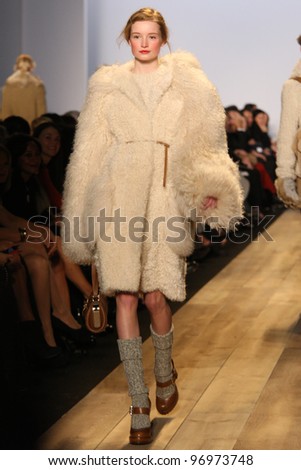 NEW YORK - FEBRUARY 15: Model Maud Welzen walks the runway at the Michael Kors FW 2012 collection presentation during Mercedes-Benz Fashion Week on February 15, 2012 in New York.