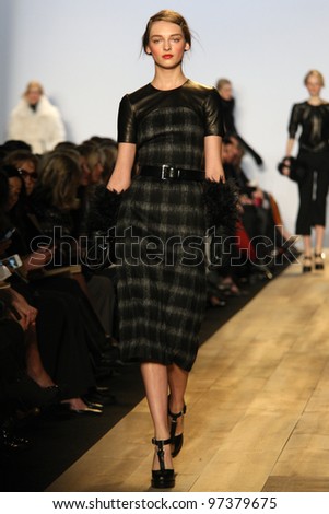 NEW YORK - FEBRUARY 15: Model Daria Strokous walks the runway at the Michael Kors FW 2012 collection presentation during Mercedes-Benz Fashion Week on February 15, 2012 in New York City, NY