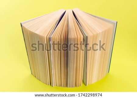 Similar – Image, Stock Photo Colourful thick open books stand on a wooden background