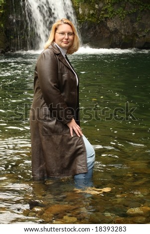 Model in Leather Jacket Near a waterfall