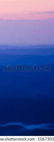 Vertical Panorama of mountain ridges at sunrise