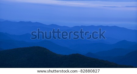 A panoramic view of the Blue Ridge Mountains at disk. This classic view of the receding ridges is from the Cowee Mountain Overlook along the Blue Ridge Parkway.