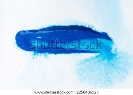 Blue watercolor Brush Stroke on white paper canvas. Abstract art background