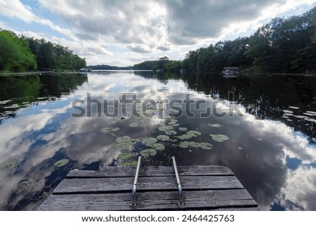 Similar – Image, Stock Photo Cloud drama and lakeside with reflection in moor lake