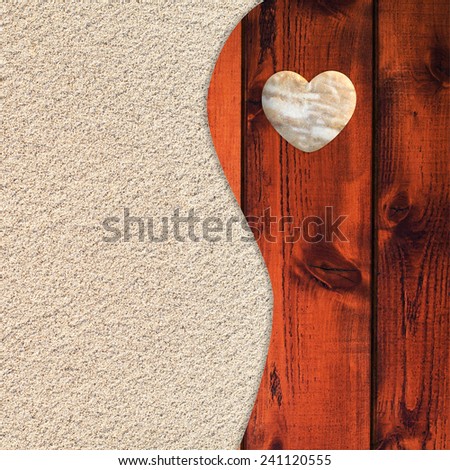 Tranquil zen-like pattern from two parts includes sand and planks background with heart shaped pebble.