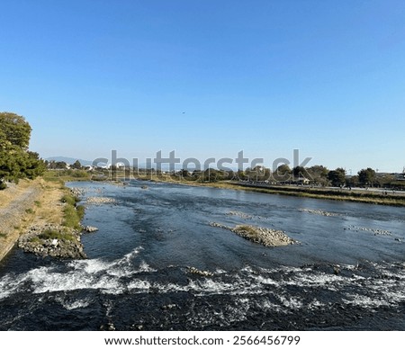 Similar – Image, Stock Photo Rocky mountains surrounding rippling sea under cloudy sky