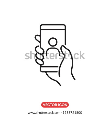video chat icon on mobile phone,  hand holding smartphone for online video with a friend, Editable stroke, vector illustration