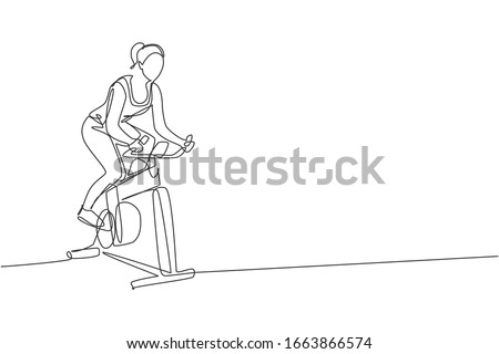 Single continuous line drawing of young sportive woman training endurance with static bike in sport gymnasium club center. Fitness stretching concept. Trendy one line draw design vector illustration