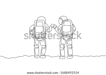 One continuous line drawing of two young happy astronauts giving fist bump gesture in moon surface, rear view. Space man deep space concept. Dynamic single line draw design vector graphic illustration