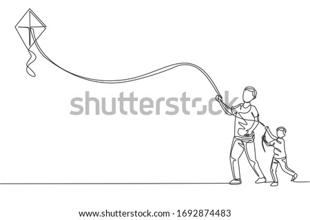 One single line drawing of young father and his son playing to fly kite up into the sky at outdoor field vector illustration. Happy family bonding concept. Modern continuous line draw graphic design