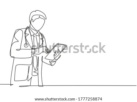 One single line drawing of young male doctor pose standing to read a journal health and medical record on tablet. Medical health care research concept continuous line draw design vector illustration