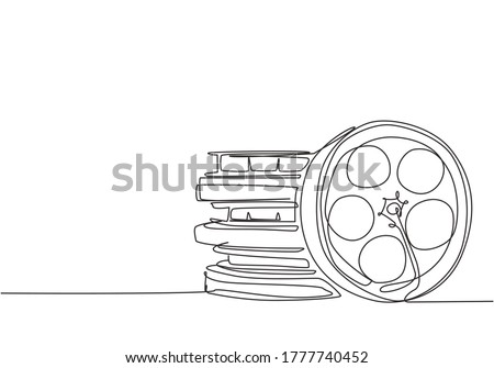 Single continuous line drawing stack of retro old classic cinema video film reels. Vintage movie frame filmstrip item concept one line draw design vector illustration graphic