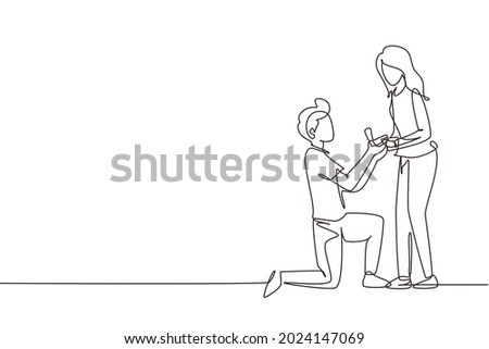 Continuous one line drawing man kneeling holding engagement ring proposing woman marry him happy marriage wedding concept. Guy on knees proposing girl to marry. Single line draw design vector graphic