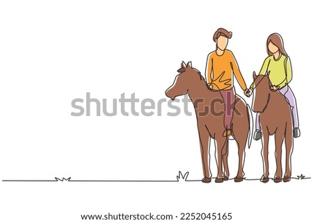 Similar – Image, Stock Photo A couple is horse riding on a meadow facing the distance. Romantic and active outdoor date. Autumn landscape, with young couple enjoying a horse riding. Overcast weather, beautiful horses.