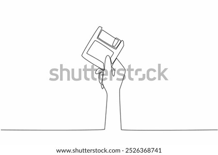 Single one line drawing hand holding a floppy disk. Ancient storage technology. Small storage size. Easily infected by viruses. Diskette. World Backup Day. Continuous line design graphic illustration