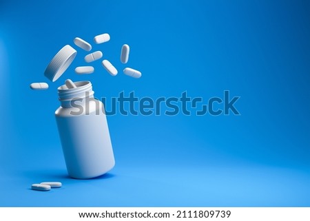 White pills from plastic medicine bottle on blue background with copy space. Medicine and health concept. 3d rendering. Imagine de stoc © 
