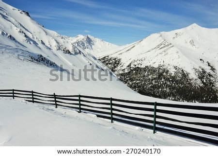 Black Fence on Ski Hill in Beautiful Rocky Mountains