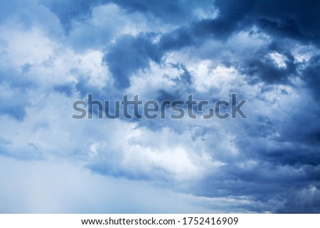 Stormy cloudy sky panorama, dramatic dark blue thunderclouds, white fluffy cumulus clouds close up, thunderstorm landscape, overcast bad weather, cloudiness skies, cloudscape, atmosphere, heaven, air ストックフォト © 