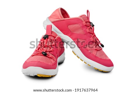 Red sneakers white background isolated close up front side view, pink sport sneaker shoes, pair running gumshoes, two fabric fitness boots, athletic leather footwear, fashion walking textile footgear Photo stock © 