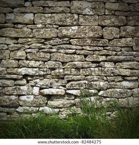 old rustic dry stone wall in rural setting