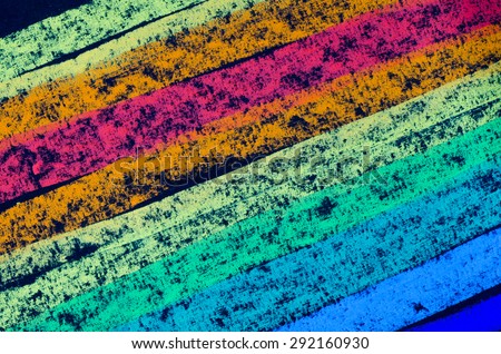 crayon drawn rainbow spectrum on black background