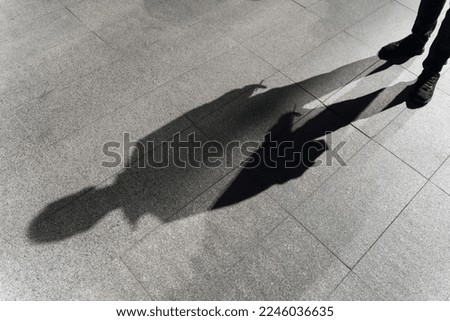 Similar – Image, Stock Photo Murderer, standing in black letters, as lettering, on an old squat house, with many windows, behind a brick wall painted with graffiti. Sign as an appeal against racism, war, hatred, violence, brutality and discrimination.