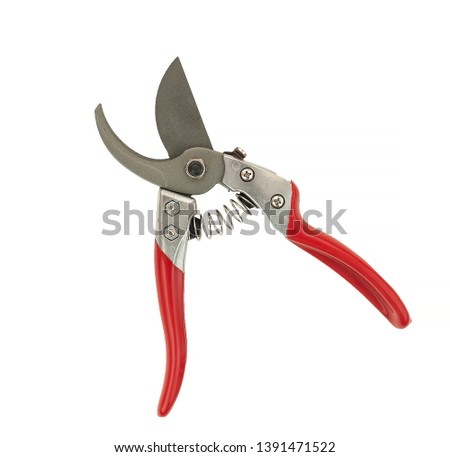 Red pruning shears, garden secateurs or hand pruners are garden tools used in gardening for cutting tree branches and landscaping gardens, isolated on white background with a clipping path cutout. Photo stock © 