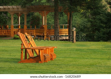 pair of lawn chairs at a lodge
