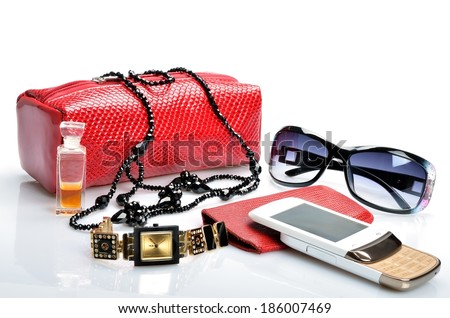 Ladies handbag with cosmetics, accessories, sunglasses, cell phone, watch