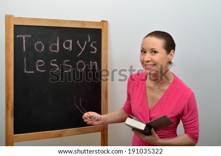 Woman teacher asks students to the topic of the lesson