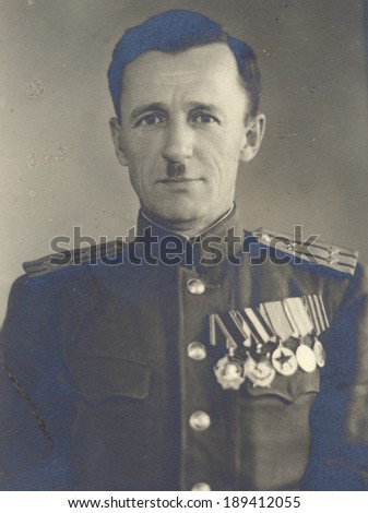 Ussr - CIRCA 1945: studio photo portrait of Colonel of the Soviet Army, RUSSIA ORDER OF LENIN, SOVIET ORDER OF THE RED BANNER, and three medals.