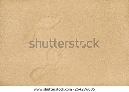 human footprints on the beach sand, sea vacation concept