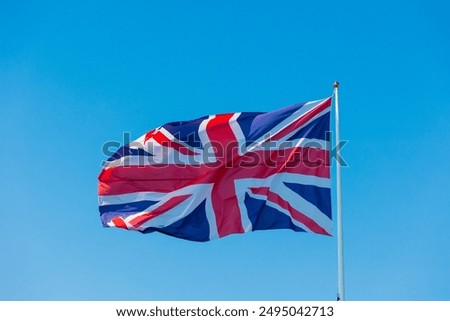 Similar – Image, Stock Photo Union Jack flag flying above a pebble beach