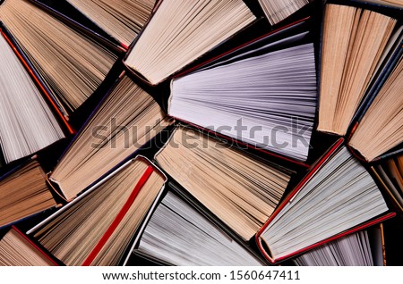 Similar – Image, Stock Photo Colourful thick open books stand on a wooden background