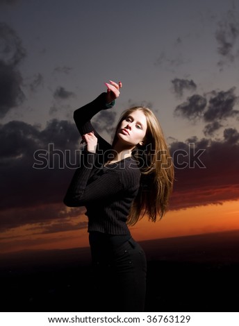 Beuaty european girl dances on a sunset