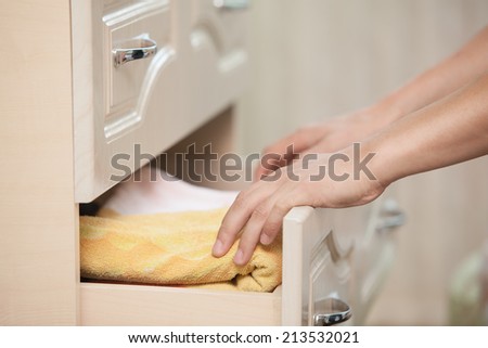 Male hands removed from the dresser towel