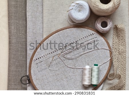 Openwork embroidery, hemstitch in the frame and different kinds of natural fabrics plain weave