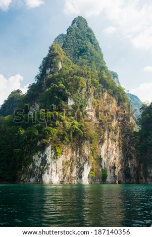 The triangle shaped mountain on the water in Khao Sok, Thailand