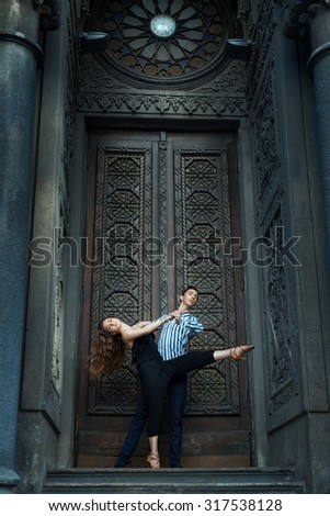 Girl with long hair dancing with a guy, passionate dance. See more photos of this series.