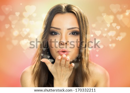 Picture of beautiful woman blowing hearts, cute female send romantic kiss, Cupid girl, Valentines day, sweet holiday, romance and love concept