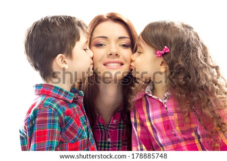 Portrait of children kissing her mother with flowers. Mothers day concept. Family holiday. Isolated white background