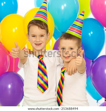 Two little boys at birthday party. Holidays concept.