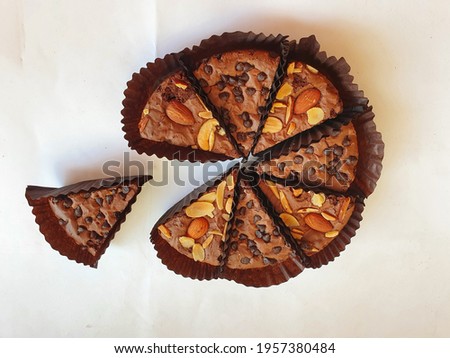 Similar – Image, Stock Photo eight pieces of chocolate cake in muffin tins